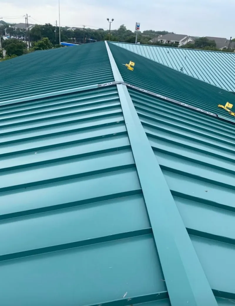 Green commercial metal roof ridge and valley for Metal Roof Repair in Onalaska
